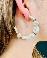 Lightweight boho earrings featuring cream cowrie shells
