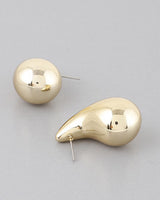 Gold shiny teardrop earrings, side profile view