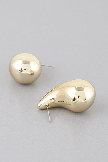 Gold shiny teardrop earrings, side profile view