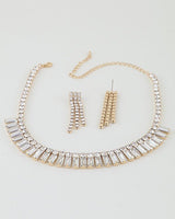 Gold-tone choker necklace set with linked clear crystals and stud earrings