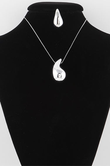 Silver teardrop necklace and earring set on display bust