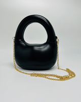 Compact Modern Gleam Handbag with smooth curves and futuristic shape
