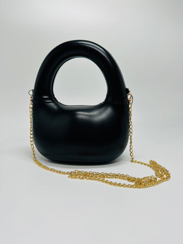 Compact Modern Gleam Handbag with smooth curves and futuristic shape