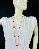 Fuchsia long necklace laid flat – 36″ length and bold color beads