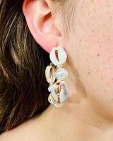 Cowrie shell statement earrings in natural tones