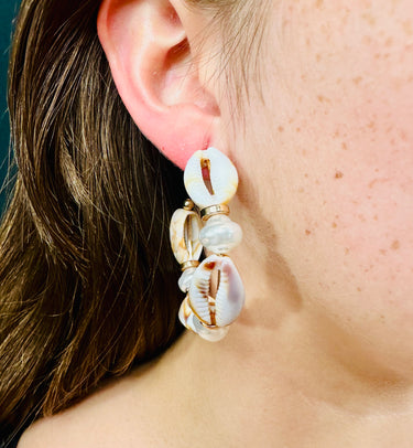 Cowrie shell statement earrings in natural tones