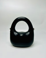 Modern Gleam Handbag in black – sculptural handbag with glossy finish