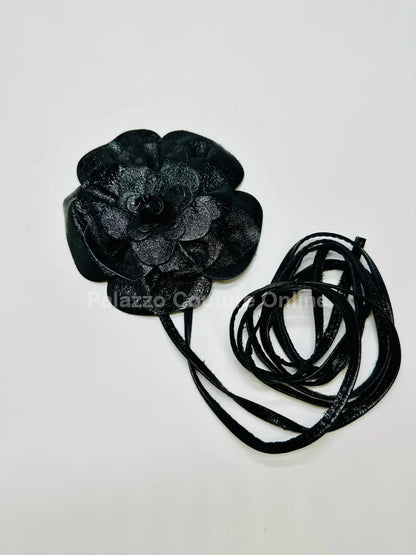 Black leather flower choker with a striking handcrafted design for women.