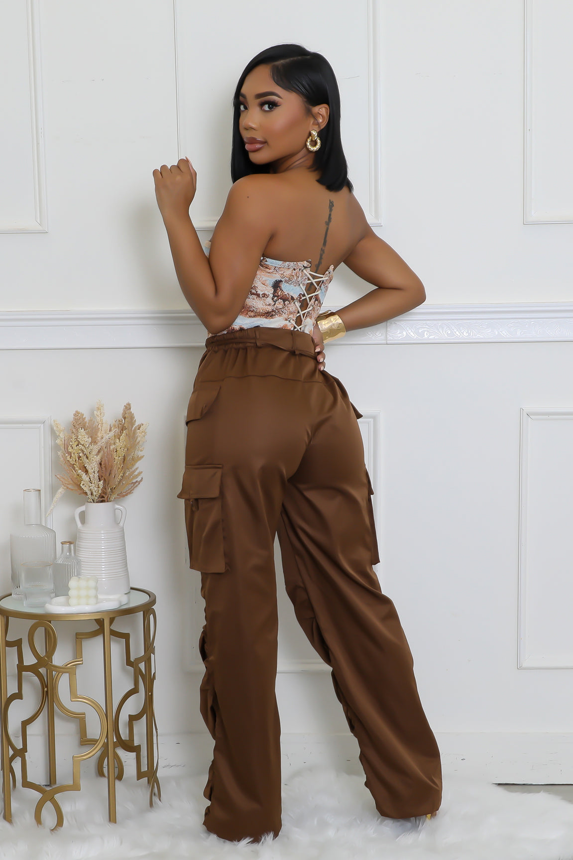 Brown utility pants with drawstring waist and ruched legs for women.