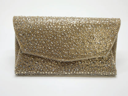 Shimmering gold evening bag with an envelope-style design and sparkling crystals.
