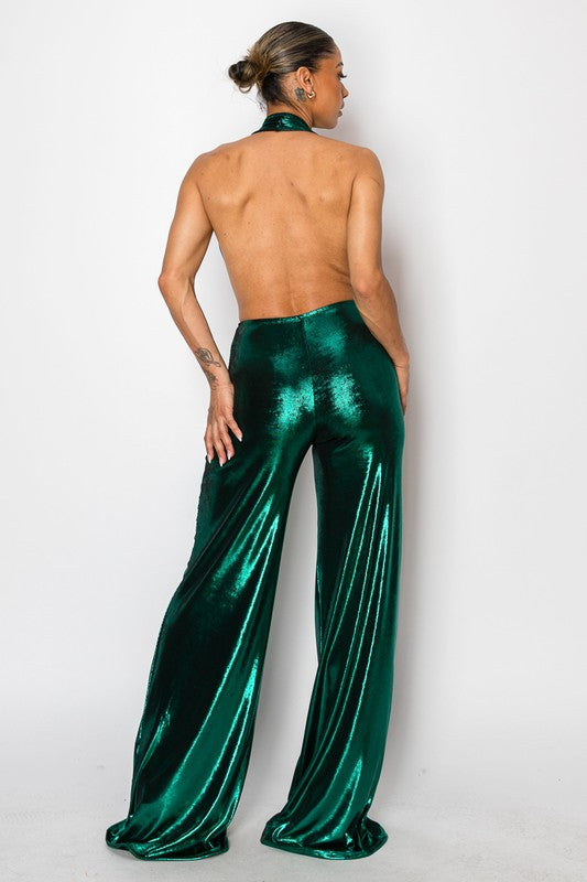 Elegant metallic green jumpsuit with a halter neckline and shimmering finish, perfect for evening events.
