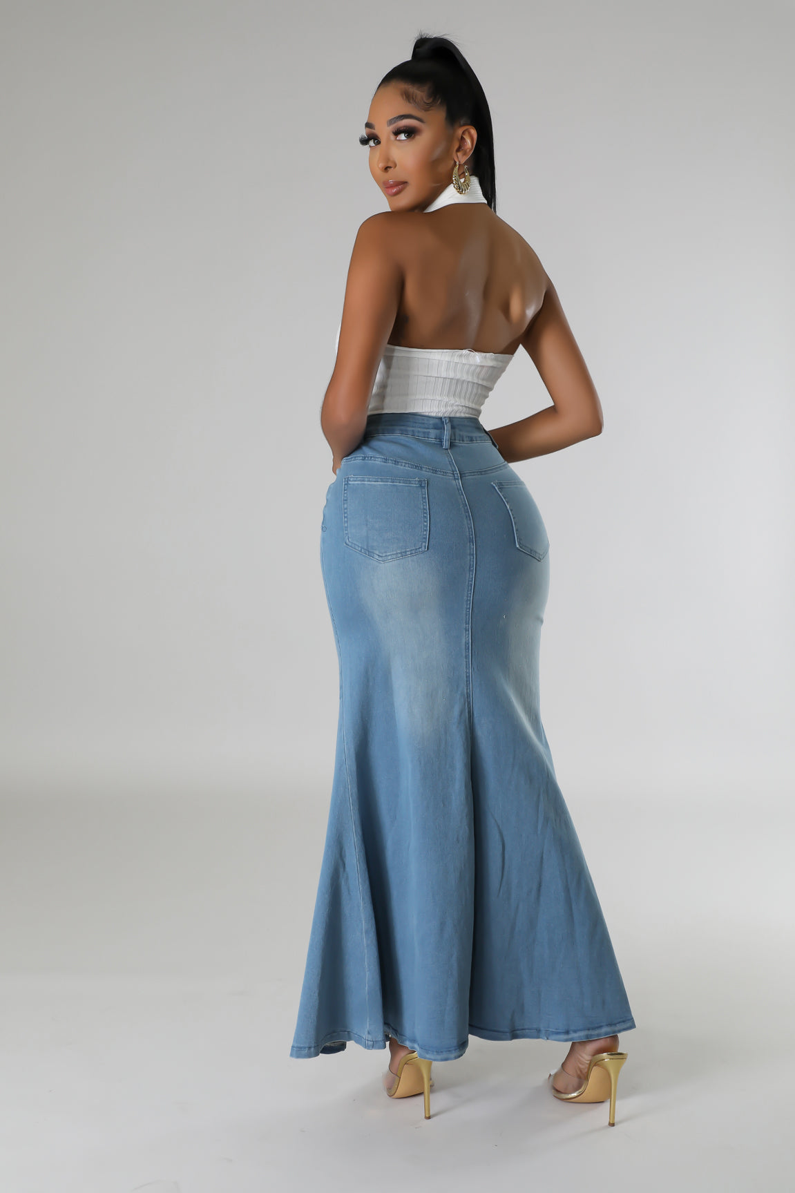 Full-length denim skirt in a light wash with back pockets.