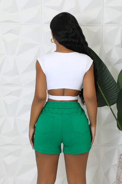 Green and grey denim shorts featuring white side stripes and an elastic waist.
