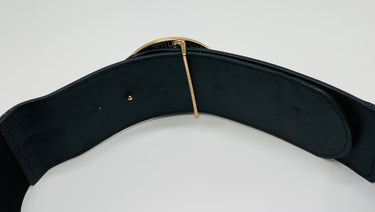 Black elastic fashion belt with gold lion buckle accent