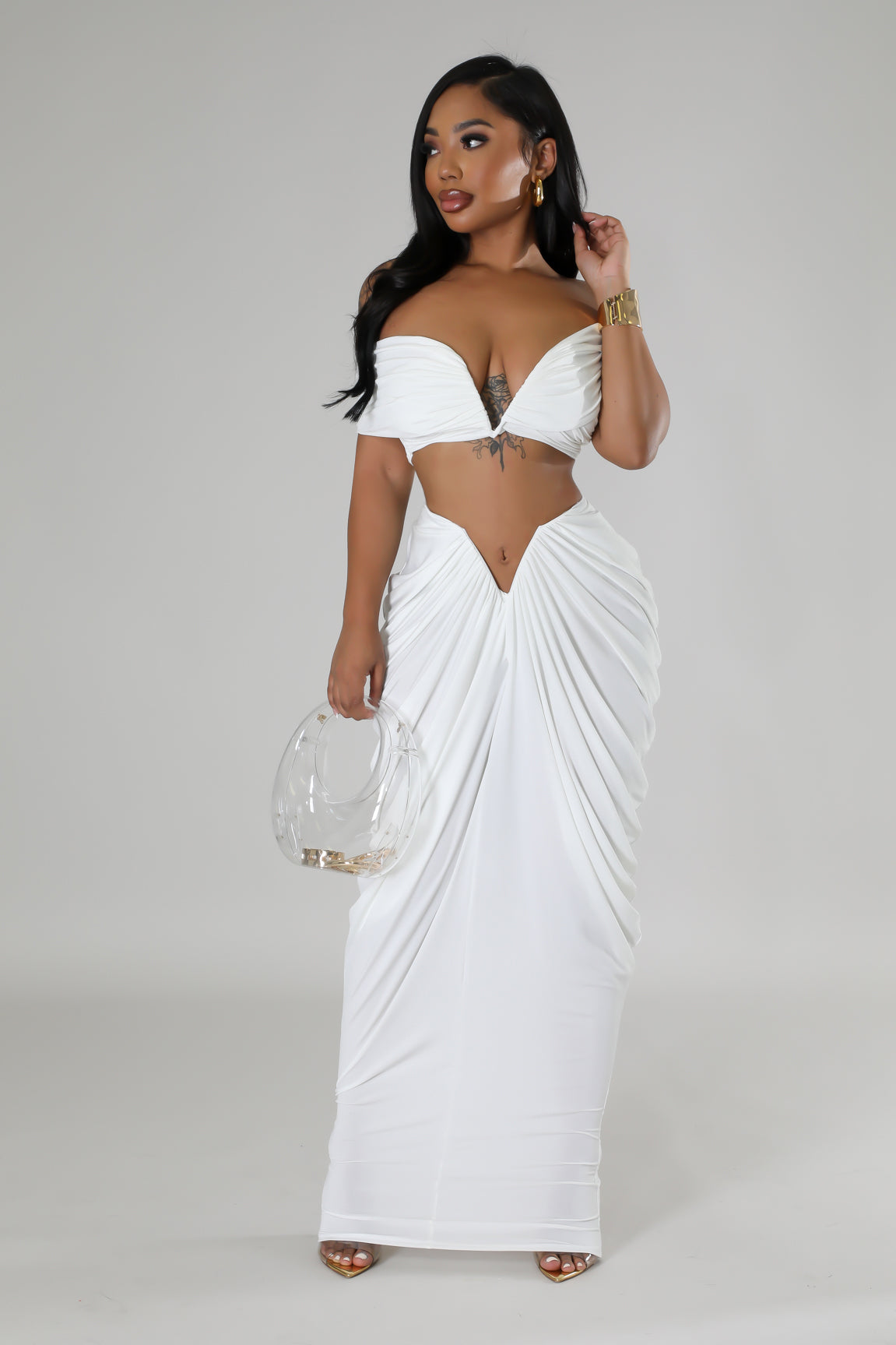 Beautiful white two-piece evening gown with draped skirt