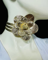 Gold leather wrap belt with floral centerpiece