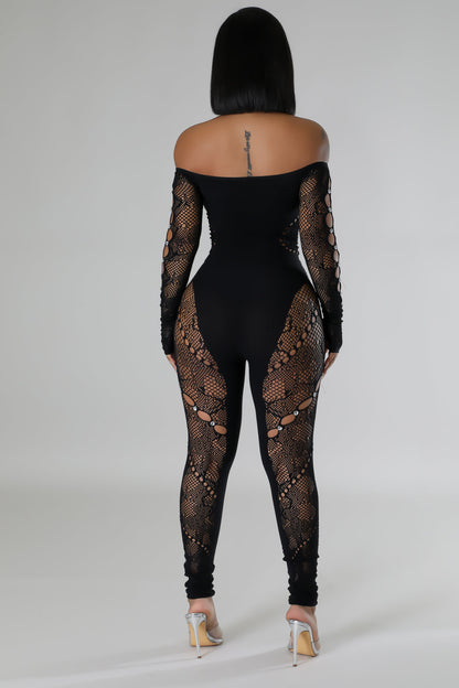 Elegant black jumpsuit featuring mesh cutouts and lace details