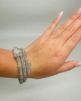 Double wrap silver bracelet styled around wrist, no background