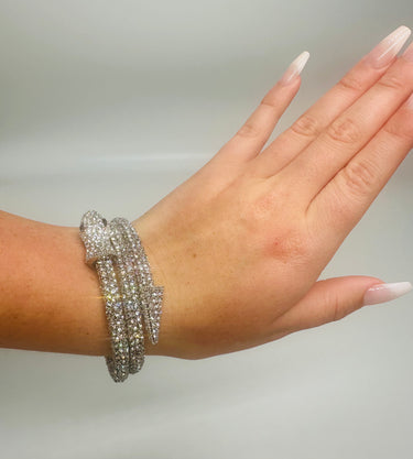 Double wrap silver bracelet styled around wrist, no background