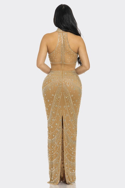 Stunning nude gown with dazzling crystal embellishments and elegant design.
