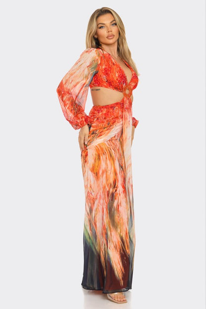 Elegant maxi dress with red and orange abstract print and long sleeves