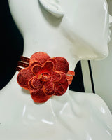 Orange leather wrap belt with floral centerpiece