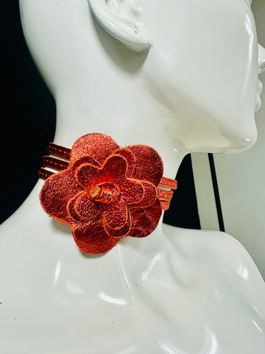 Orange leather wrap belt with floral centerpiece