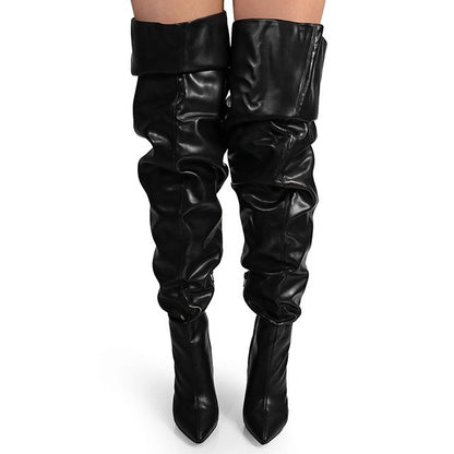 Fashionable women's over-the-knee boots in black leather, featuring a slouchy silhouette and high block heel.