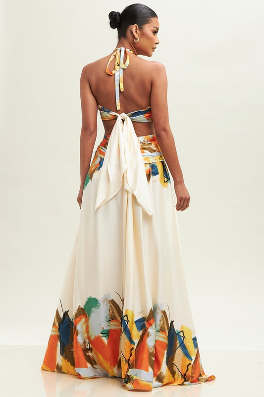 Sleeveless halter neck maxi dress featuring a colorful abstract design.