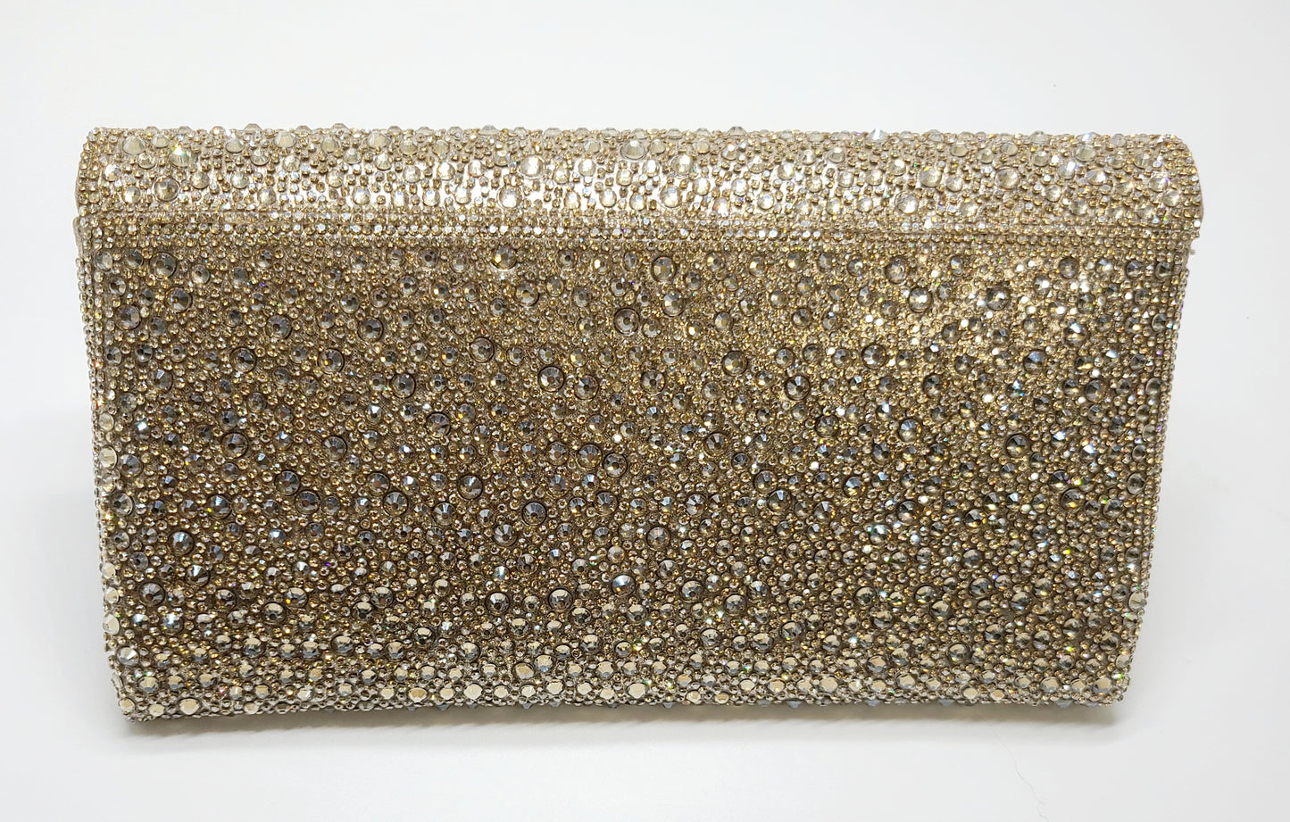 A dazzling gold clutch adorned with sparkling rhinestones, ideal for elegant evenings.
