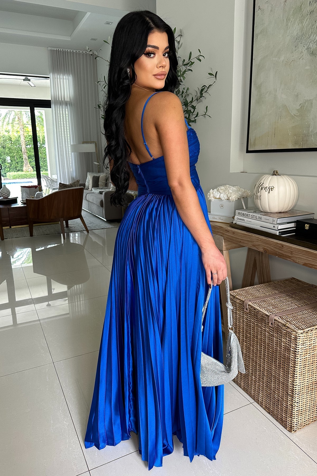 Elegant pleated royal blue maxi dress with spaghetti straps, ideal for formal events.