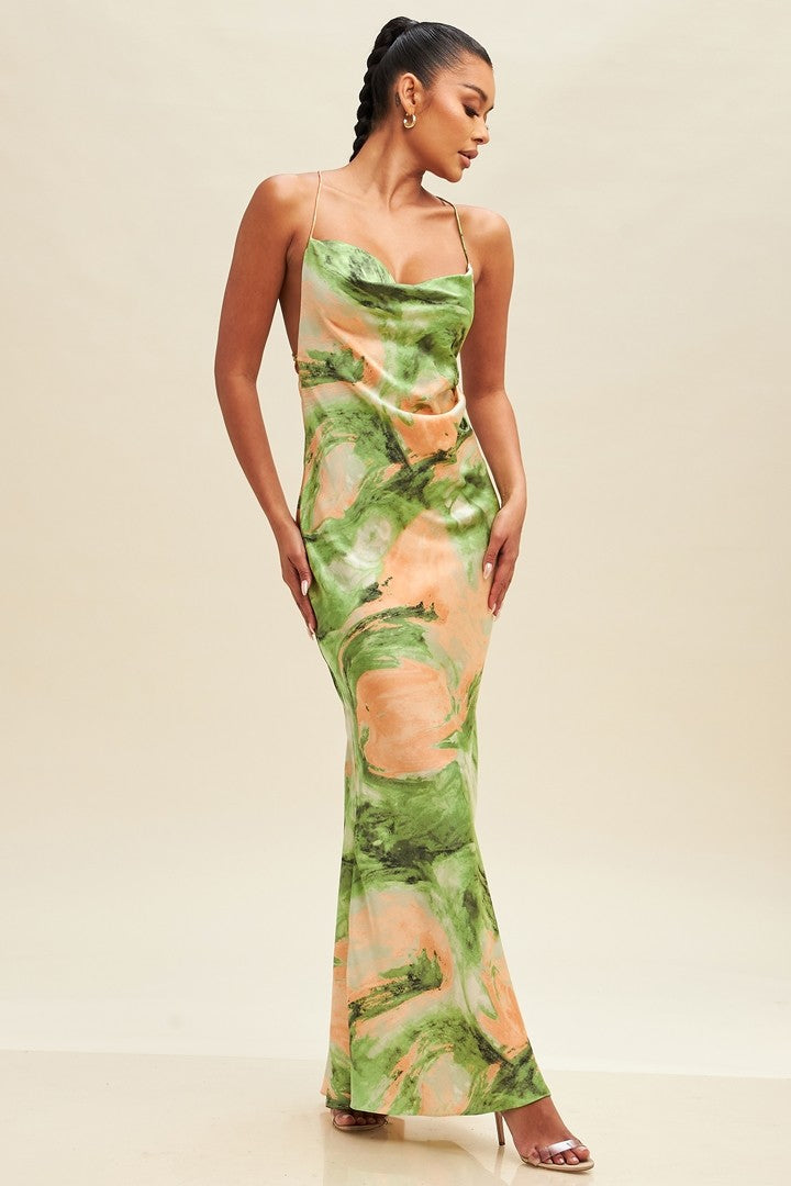 Women's stylish backless maxi dress with a unique green and peach watercolor print.