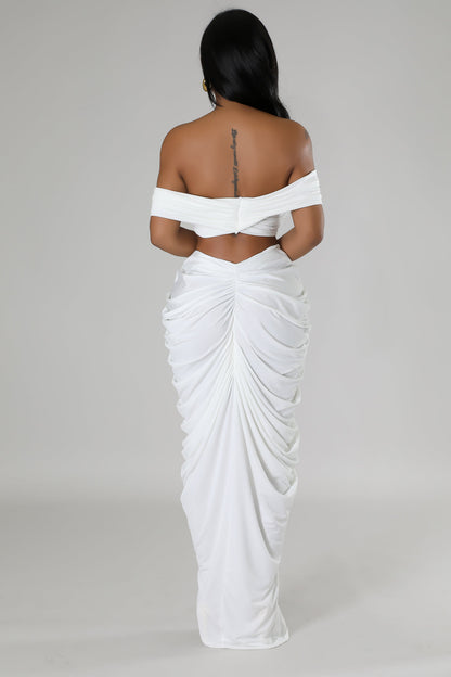 Elegant white off-shoulder dress featuring a draped skirt