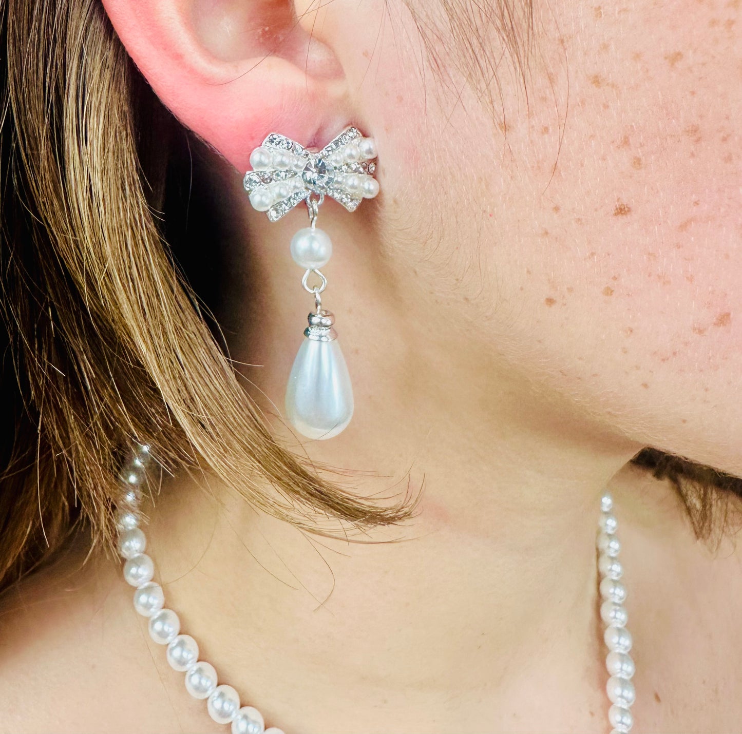 necklace and matching earrings adorned with delicate pearls