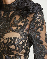 Elegant Black lace mini dress on model styled for going out