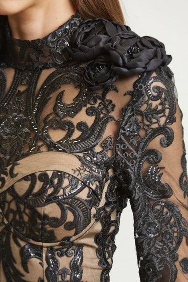 Elegant Black lace mini dress on model styled for going out