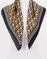tan and black monogram pattern bandana close-up