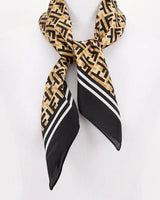 black silk monogram bandana with geometric print flat lay
