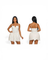 Elegant White corset mini dress on model styled for going out