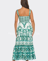Green and white dress with detailed Mosaic pattern and maxi length.