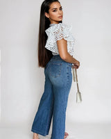Bold Detail Button-Up Wide Leg Jeans close up of wide leg fabric and construction detail