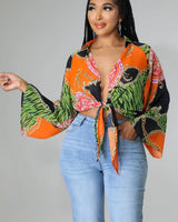 Charity Babe Printed Tie Top with Plunging Neckline and Long Sleeves front view showing long sleeve design