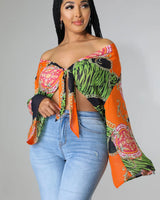 Charity Babe Printed Tie Top with Plunging Neckline and Long Sleeves close up of print fabric and sleeve detail