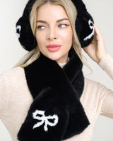 front view of black fluffy winter scarf and bow ear muff set