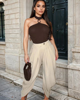 Chic Draped Pleated Pants - Beige front view showing jeans fit and silhouette