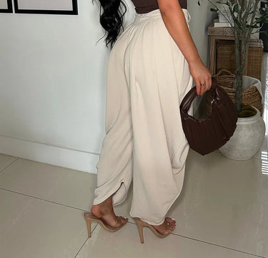 Chic Draped Pleated Pants - Beige side view showing jeans leg shape and fit