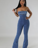 Blue denim jumpsuit with wide‑leg silhouette