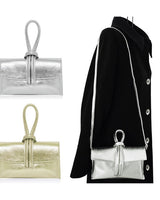 Pearl gold handbag made of genuine leather with sleek structure