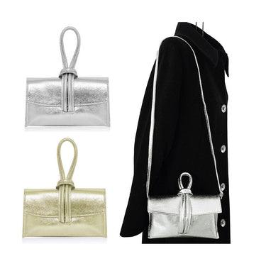 Pearl gold handbag made of genuine leather with sleek structure