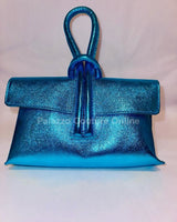 Metallic turquoise leather handbag with structured flap design